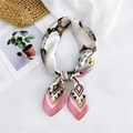 Elegant bow-tied silk scarf featuring colorful geometric and feather patterns in pink and yellow - Pink Feather Tribal