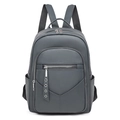 Detailed view of grey lychee texture PU leather backpack with front zipper and side pockets - Gray