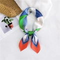Silk-touch square scarf featuring bold geometric color blocks in blue and green - Orange Triangle Patchwork
