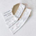 White ice silk cooling sun sleeves featuring light pink floral patterns and elastic cuffs - 3 Ink Circle Pink