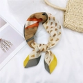 Chic multi-color geometric print linen-cotton square scarf styled in a knotted bow tie - 21 Cotton Horse Head Yellow Grey