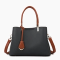 Two-tone tote bag in black pebbled leather with brown handles and gold-tone hardware - Black Single Bag