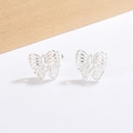 Elegant silver bow stud earrings with hollow mesh texture on a minimalist background - Hollow Bow Style (C342)