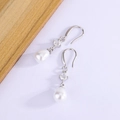 Elegant S925 silver pearl drop earrings with round zircon stones in a minimalist style - White Gold