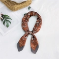 Elegant vintage brown paisley square neck scarf tied in a stylish knot on white fabric - Orange Butterfly Paisley