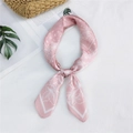 Pink paisley floral satin square scarf shown on a rustic woven bag for summer fashion - Pink Floral Paisley