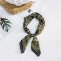 Olive green paisley square silk scarf with dark brown border in a knotted loop display - Green Butterfly Paisley