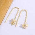 Elegant gold flower tassel earrings with yellow opal petals and sparkling center crystals - Gold