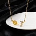 Elegant gold tulip necklace with yellow teardrop gemstone and sparkling zircon leaves - Necklace / Gold Yellow