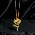 Exquisito collar de girasol dorado con gemas coloridas sobre fondo de seda negra - Estilo Girasol Zirconia Colorido (I)