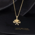 Detail of gold graduation cap pendant with sparkling zircon inlays on a black silk backdrop - Cap and Scroll with Rhinestones Style (S)