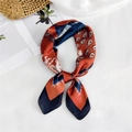 Rust orange and navy blue paisley silk-feel square scarf tied in a stylish loop - Paisley Navy