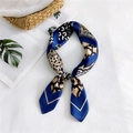 Elegant silk scarf with leopard print and navy border in stylish knotted display - Leopard Navy Blue