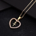 Collar de corazón dorado con colgante de cruz y cristales micro-pavé sobre fondo negro - Estilo de Zirconia Blanca (A)