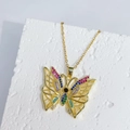 Golden hollow butterfly pendant necklace with colorful zircons on white stone pedestal - Multicolor Hollow Butterfly Necklace (E)