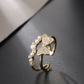 Detail of gold-plated bow ring with white pearls and sparkling zircon accents - Zircon Bowknot Pearl Style (V)