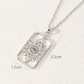 Detailed macro view of silver rectangle evil eye pendant with blue and white zircons - Silver Rectangular Style (R)