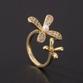 Macro detail of gold flower ring featuring cubic zirconia petals and a center white pearl - Double Flower Pearl Style (J)