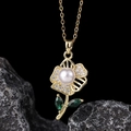 Macro detail of gold flower pendant necklace with white pearl and green zircon stones - Pearl Flower Green Leaf Style (C)