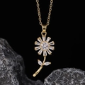 Macro shot of gold daisy pendant featuring marquise-cut zircons on a delicate chain - Daisy Square Zirconia Petal Style (F)