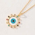 Gold evil eye necklace with colorful zircons and blue enamel charm on white texture - Colorful Zirconia Sunburst Style (A)