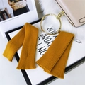 Ginger yellow knitted arm sleeves with vertical ribbed texture and gold ring hardware - Ginger Yellow