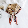 Elegant champagne silk scarf with black polka dots and striped border on white texture - Polka Dot Orange Edge