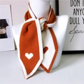 Orange and white knit scarf with heart patterns shown on a white neck model stand - Pointed Style / Orange Knitted Heart