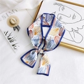 Floral print twilly scarf with blue edges and abstract patterns tied in a bow - Curtain Buckle Blue
