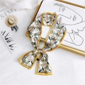 Floral print long silk scarf with yellow border tied in a bow on artistic background - Dandelion Yellow
