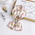 Elegant ivory twilly scarf featuring pink peach patterns and black polka dots - Pear Camel
