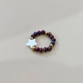 Colorful beaded elastic ring with gold accents and a white star charm accessory - Multicolor Swirl Star Style / Colorful