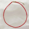 Handmade red beaded necklace with gold metal spacers and lobster clasp detail - Red