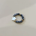Elastic beaded ring featuring zebra pattern beads, gold spacers, and a white star charm - Black White Zebra Star Style / Black and White