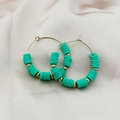 Bohemian gold hoop earrings featuring mint green clay beads and golden spacers - Green