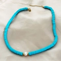 Blue Heishi beads necklace featuring a central faux pearl and golden metal clasp - Sky Blue