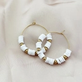 Bohemian gold hoop earrings featuring white heishi beads and gold metallic accents - White