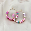 Bohemian gold hoop earrings with multi-colored polymer clay beads on silk background - Colorful