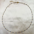Elegant gold necklace with minimalist blue beads and adjustable lobster clasp closure - Blue