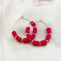 Bohemian gold hoop earrings with bright pink heishi clay beads on white silk - Red