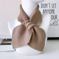 Cross-style solid color knitted scarf in light brown for winter warmth and elegant styling - Camel