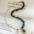 Asymmetric necklace with natural stones pearls and gold oval pendant on a book - Pearl and Crushed Stone Patchwork