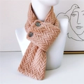 Light camel knitted scarf with button details on a white mannequin torso display - Pink