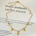 Collier vintage en acier doré avec cinq pendentifs étoiles givrées sur chaîne en O - Style Étoile