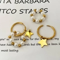 Orecchini a cerchio dorati con ciondolo a stella e perle per le donne - Orecchini a stella