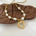 Lava texture hollow heart pendant necklace with pearls and gold beads on wood - Heart Pearl Necklace