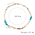 Bohemian beaded necklace with turquoise and white shells on white background - Hematite Stone Beaded Style