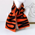 Fashionable orange and black letter pattern knit scarf shown on a mannequin - Orange & Black