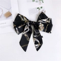 Detail of vintage pattern narrow silk scarf showing chain print and 100% polyester tag - Black Metal Chain