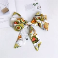 Detail of white satin ribbon scarf with colorful tarot prints on a fashion magazine - Heart Label White
